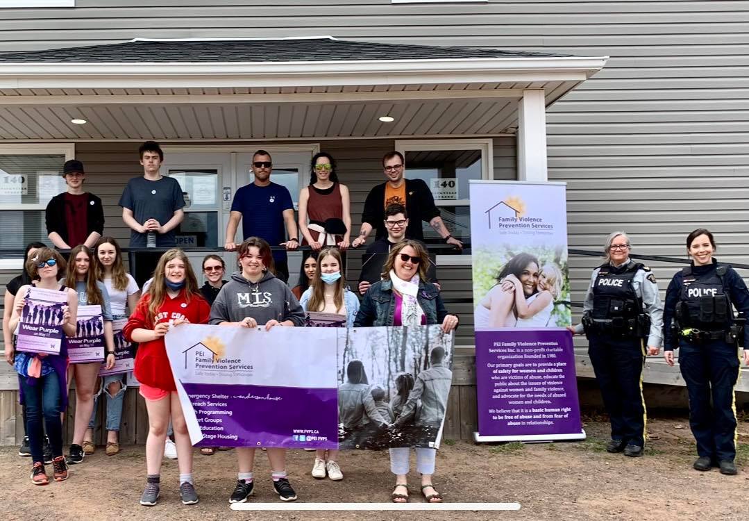 Family Violence Prevention Week 2022- Walk in Silence (Montague) Participants holding Family Violence Prevention Services Banner. 