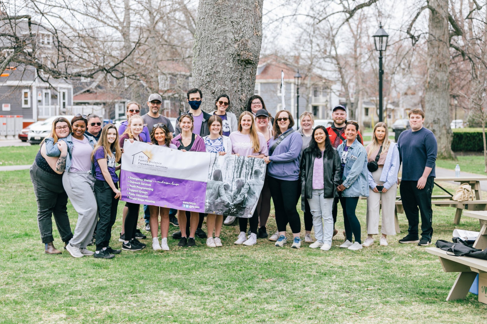 Family Violence Prevention Week 2022- Walk in Silence (Charlottetown) Participants holding Family Violence Prevention Services Banner. 