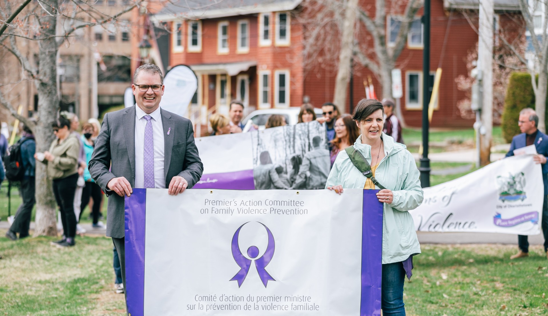 Family Violence Prevention Week- Walk in Silence (Charlottetown) Participants holding PAC on Family Violence Prevention Banner. 