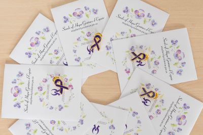 packages of flower seeds that are given out at family violence prevention events