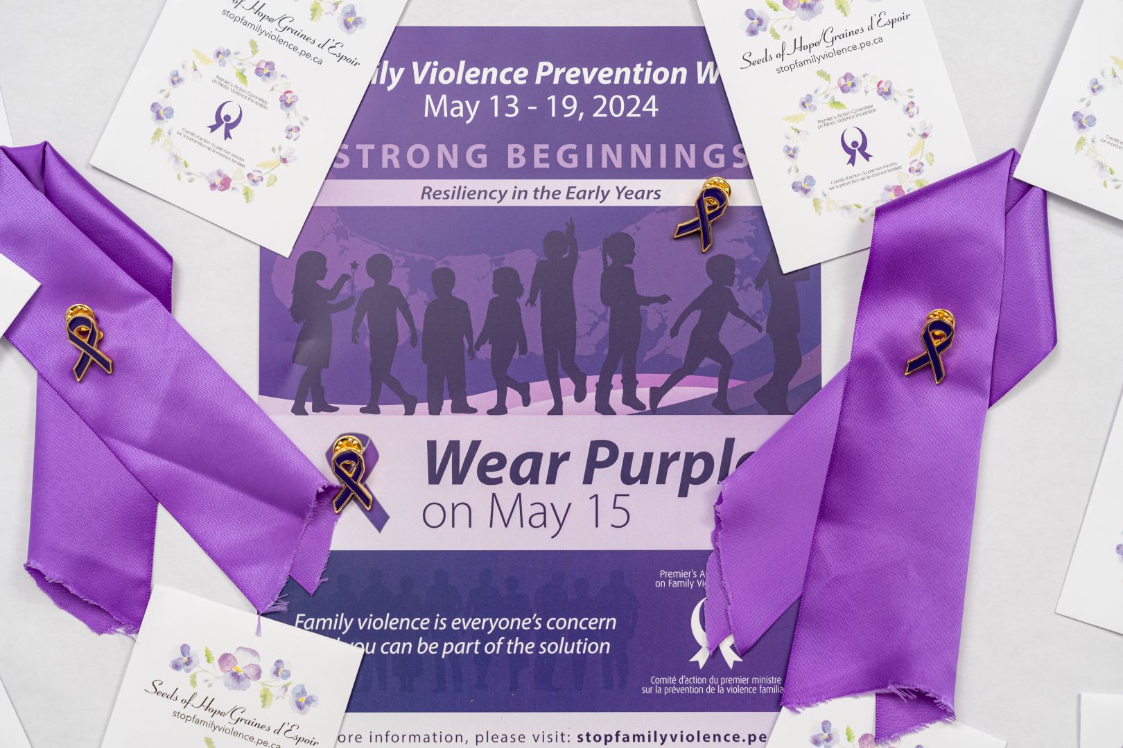 wear purple on May 15th sign and purple ribbons